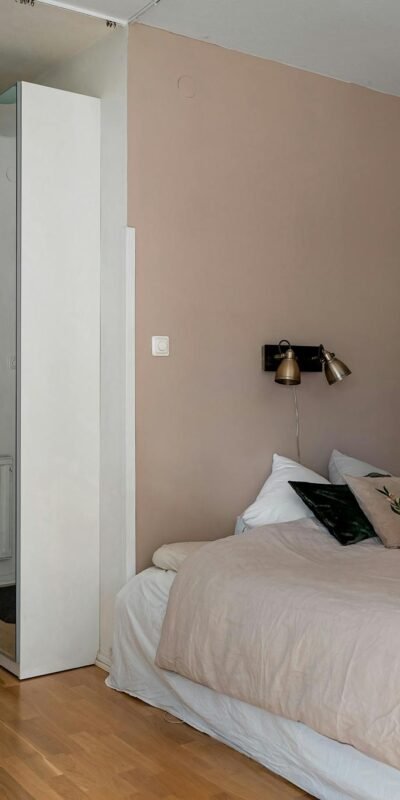 Elegant bedroom interior with neutral tones and minimalist design elements for a calming space.